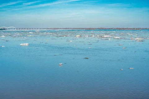 Ice drift on the river. Ice drift on a river with blue high water and big wat Stock Photos