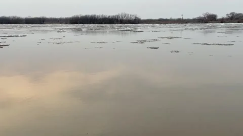 Ice drift on a river in spring during sunset Stock Footage 279938325