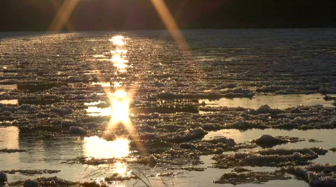 Ice drift in a river at sunset 13  Stock Footage 303954