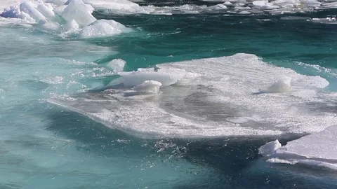 Ice drift on the turquoise river in the spring Stock Footage 73010921