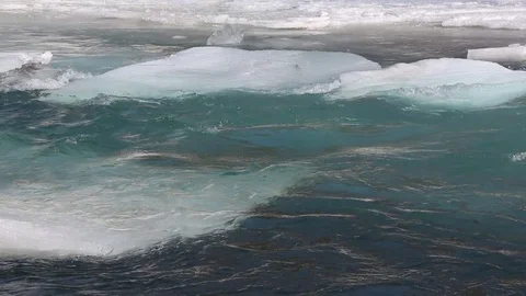 Ice drifting on the turquoise river in the spring Stock Footage 74723391