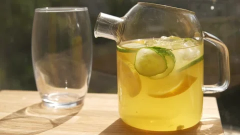 Ice drop in lemonade with garnish Stock Footage 310450732