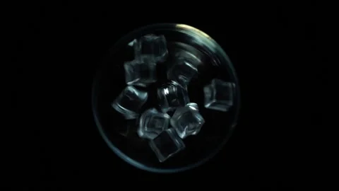 Ice Dropping Into Glass From Over The Top View Stock Footage 156499367