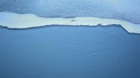 Ice edge in the river and slowly current water Stock Footage 10831230
