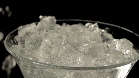 Ice falling into a glass Video stock 76471701
