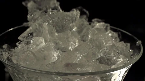 Ice falling into a glass Stock Footage 76471834