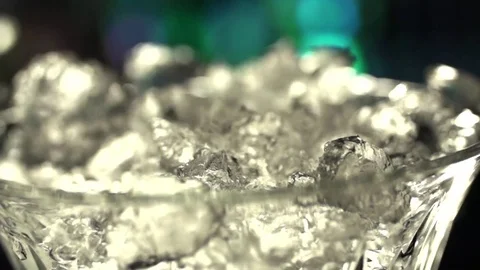 Ice falling into a glass Stock Footage 76472028