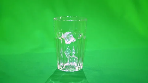 Ice falling into glass slow motion 4k chroma key Stock Footage 170697059