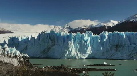 Ice falls off Perito Moreno glacier Stock Footage
