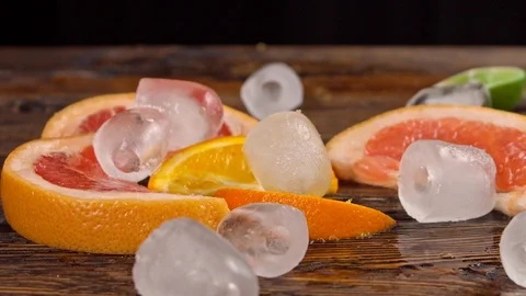 Ice falls on top of fresh fruit Stock Footage 113083255