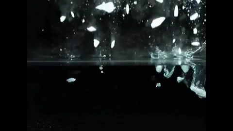Ice falls into the water Stock Footage 242015463