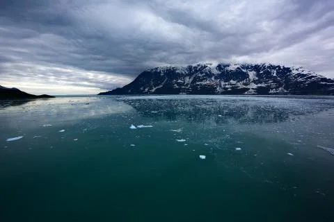 Ice field dark clouds Stock Photos