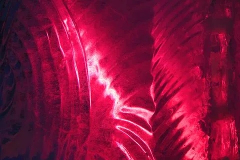 Ice figure close up, the surface is lit from inside with red light Stock Photos