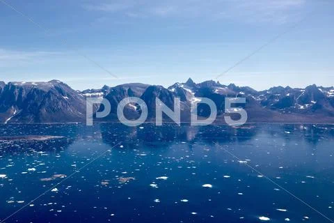 Ice fjord and mountains aerial photo Stock Photos