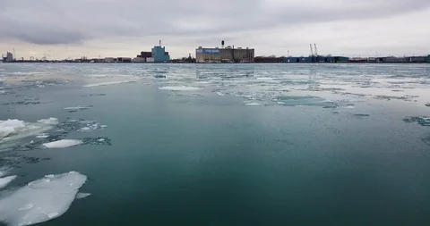 Ice floating in the cold blue water along the Detroit River with Boblo Stock Footage 102579018