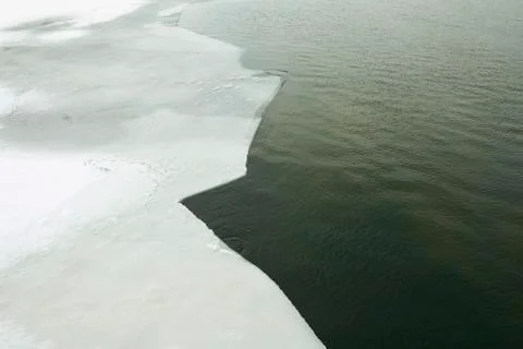 Ice floating on river in spring time. Stock Photos