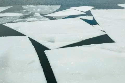 Ice floating on river in spring time. Stock Photos