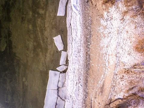 Ice floating on river in spring time. Winter landscape with melting of ice floe. Stock Photos