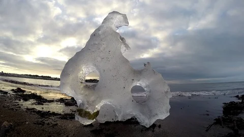 Ice floats on the water under the bridge in Eyrarbakki Iceland Stock Footage 118277045