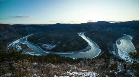 Ice floats on a winding river Stock Footage 61774946