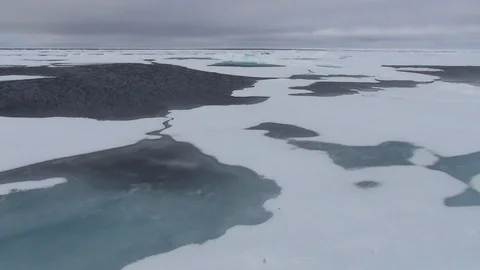 Ice floe under a cloudy sky, Arctic Ocean Stock Footage 104855585