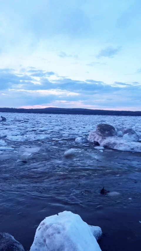 Ice Floes Breaking Up on a Vast River During Spring Thaw, Northeast China Stock Footage 337331012