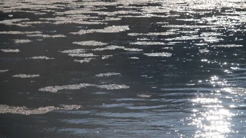 Ice floes float in a clear mountain river. Ice floats down a mountain river Stock Footage 264062032