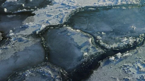 Ice floes floating on water surface on sunny winter day Stock Footage 268731099