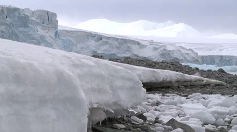 Ice flow on rocky beach, Antarctica Stock Footage 34311971