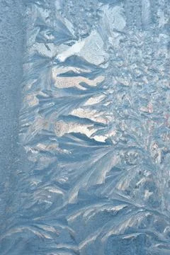 Ice flower pattern on window glass Stock Photos