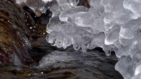 Ice in forest stream thawing in spring Stock Footage 88872584
