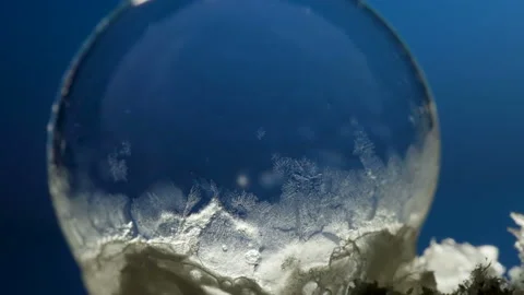 The ice forming inside freezing frozen the small soap bubble Stock Footage 148773516