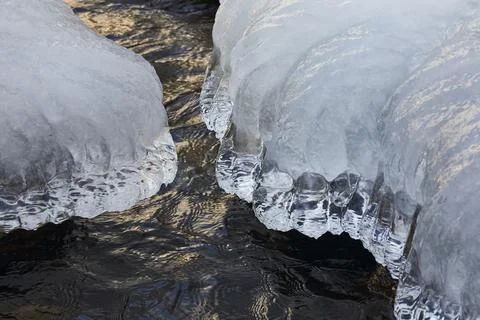 Ice forms on rocks Stock Photos