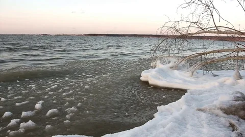 Ice in a freezing river in the fall at sunset, Ob reservoir,  Russia Stock Footage 83300127