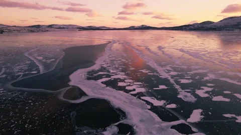 Ice on the frozen lake at sunset. Stock Footage 166625853