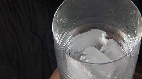 Ice into a glass Stock Footage 33712691
