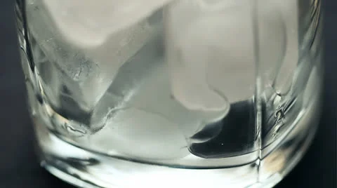 Ice in glass rotation Stock Footage 24874918
