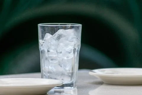 Ice glass on table Stock Photos