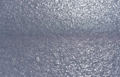 Ice glitter texture with sparkling light. Ice abstract shimmering bokeh backdrop Stock Photos