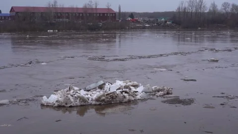 Ice goes down the river during a flood on the Belaya River in Ufa. Video stock 277594559