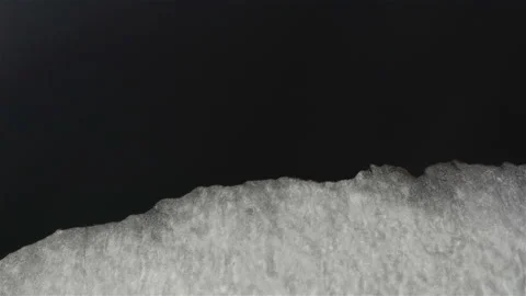 The ice gradually changes its strength and the water washes away the edges of Stock Footage 112314095