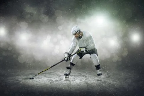 Ice hockey player on the ice, outdoors Stock Photos