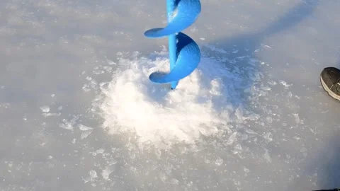 Ice hole, driling hole in ice with hand auger Stock Footage 255294801