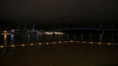 Ice hole protected white floats in river at night Vídeo Stock 82669095