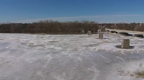 Ice Jam aerial view camera moving over ice revealing flooded parking lot Stock Footage 49738923