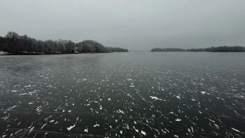 Ice lake in Germany. Winter. Drone view of ice lake. Snowy forest in winter. Stock Footage 231114100