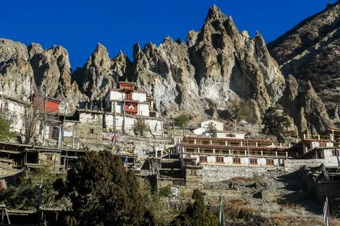 Ice Lake - A temple complex on the side of the hill in Manang Stock Photos