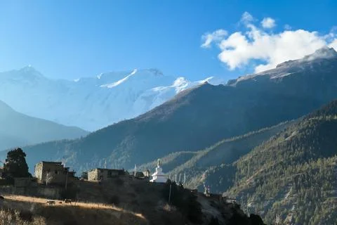 Ice Lake - A temple complex on the side of the hill in Manang Stock Photos