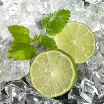 Ice with lime wedges Stock Photos