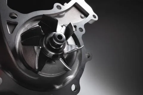 ICE liquid cooling pump. Engine coolant pump. Contrast light on gray background Stock Photos